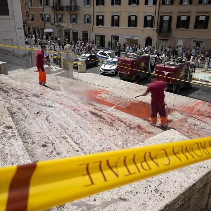 Activists pour red paint down Rome's famed Spanish Steps in outrage over femicides in Italy